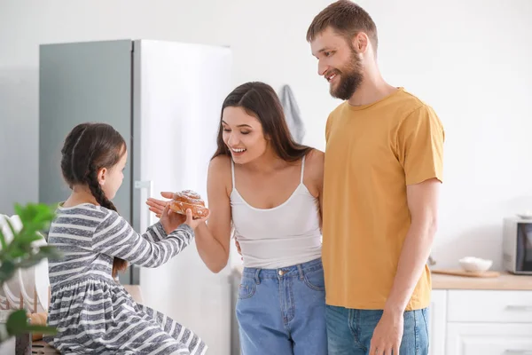 Young family together in kitchen — Stock Photo, Image