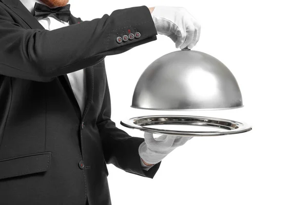 Knappe kelner met lade en cloche op witte achtergrond — Stockfoto