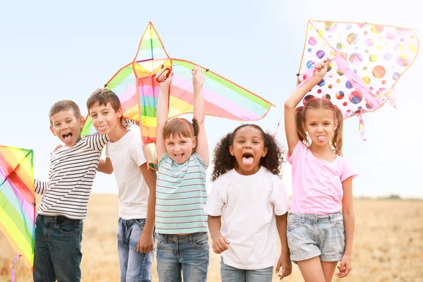 Little children flying kites outdoors — Stock Photo, Image