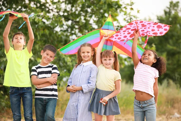 Little children flying kites outdoors — Stock Photo, Image