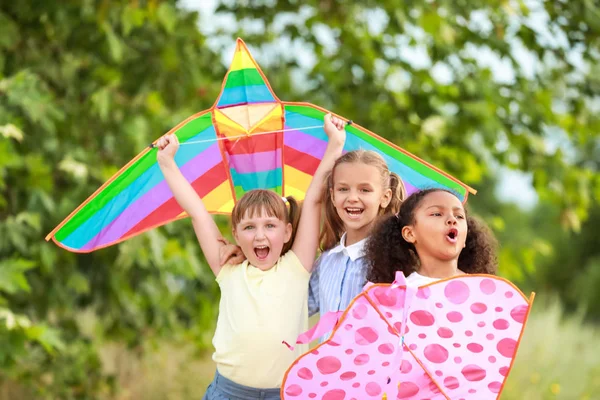 Little girls flying kites outdoors — Stock Photo, Image