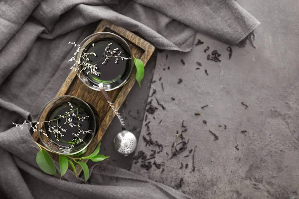 Glass cups of tasty Turkish tea on dark table — Stock Photo, Image