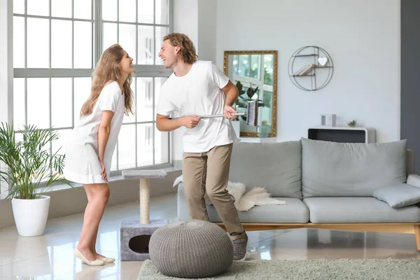 Happy young couple dancing at home — Stock Photo, Image