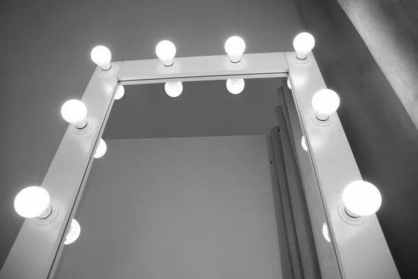 Stylish mirror in modern makeup room, closeup