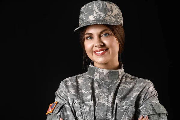 Young female soldier on dark background — Stock Photo, Image