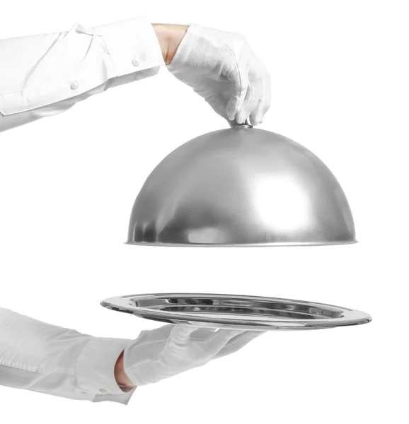 Hands of waiter with empty tray and cloche on white background — Stock Photo, Image