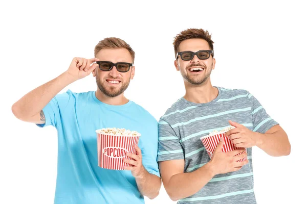 Men with popcorn watching movie on white background — Stock Photo, Image