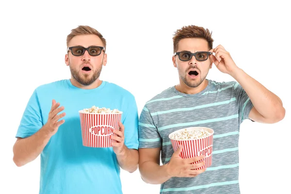 Men with popcorn watching horror movie on white background — Stock Photo, Image