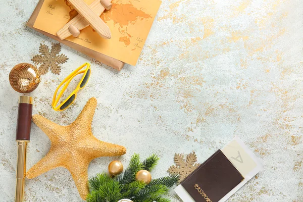 Composition with Christmas decor, passport, map and starfish on light background — Stock Photo, Image