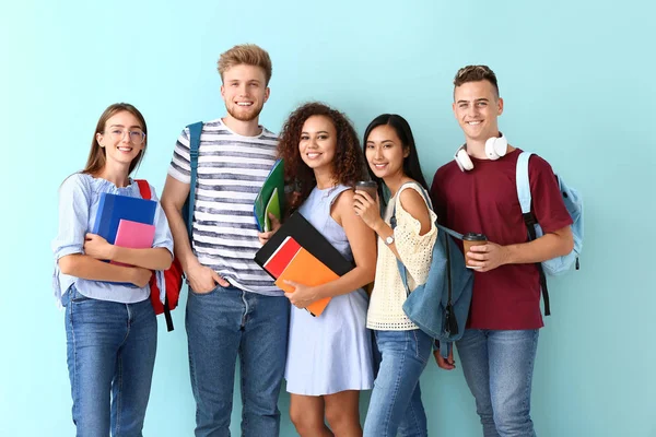 Group of students on color background — Stock Photo, Image