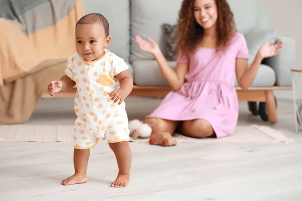 Cute little baby learning to walk at home — Stock Photo, Image