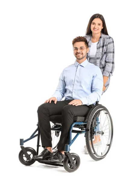 Jonge zakenman in rolstoel en met vrouw op witte achtergrond — Stockfoto