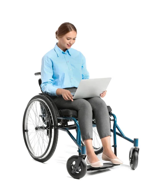 Beautiful businesswoman with laptop in wheelchair on white background — Stock Photo, Image