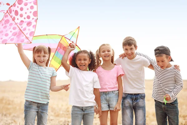 Little children flying kites outdoors — Stock Photo, Image