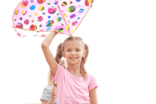 Little girl flying kite outdoors — Stock Photo, Image