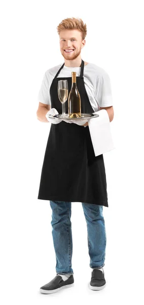 Schöner Kellner mit Champagner auf weißem Hintergrund — Stockfoto