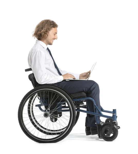 Handsome businessman with laptop in wheelchair on white background — Stock Photo, Image