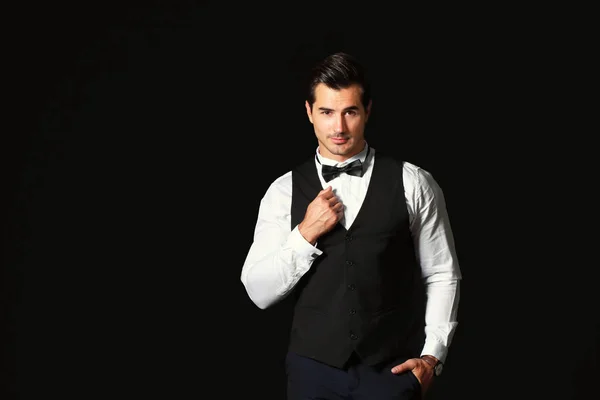 Stylish fashionable man on dark background — Stock Photo, Image
