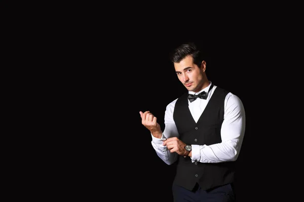 Stylish fashionable man on dark background — Stock Photo, Image