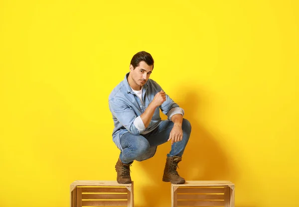 Stylish fashionable man on color background — Stock Photo, Image