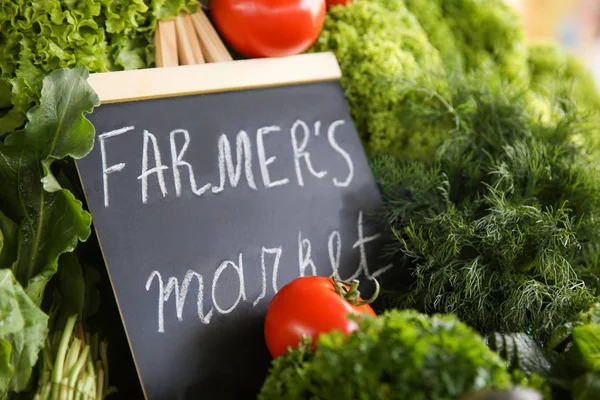 Assortment of fresh herbs on counter at farmer's market — Stock Photo, Image