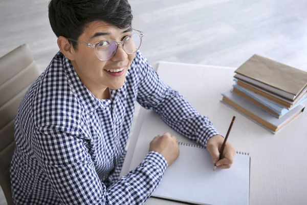 Asian student preparing for exam at home — Stock Photo, Image
