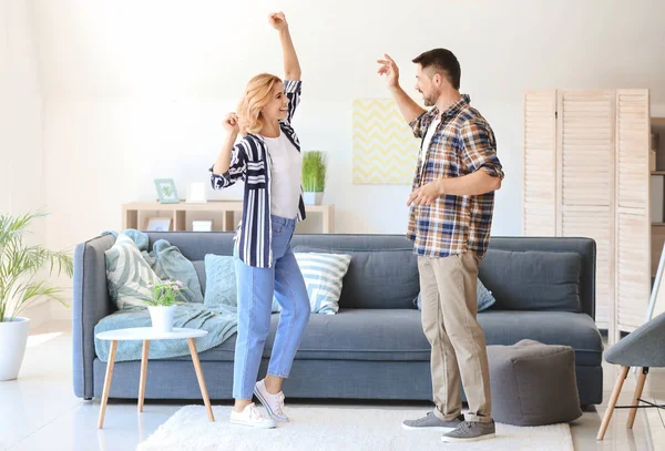 Happy dancing couple at home — Stock Photo, Image