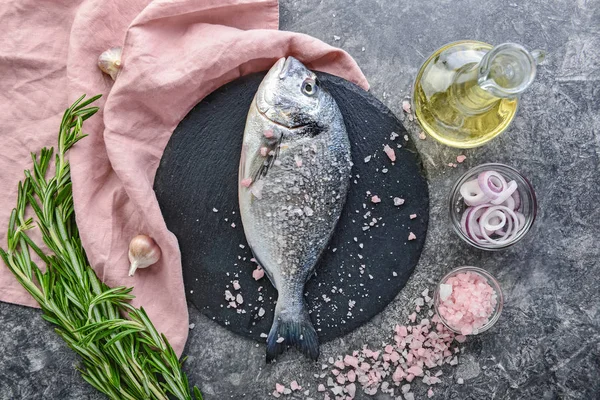 Composition with fresh dorado fish on grey background — Stock Photo, Image