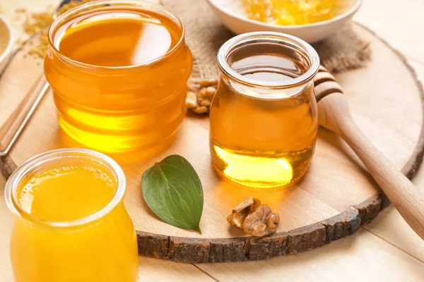 Jars of sweet honey on table — Stock Photo, Image