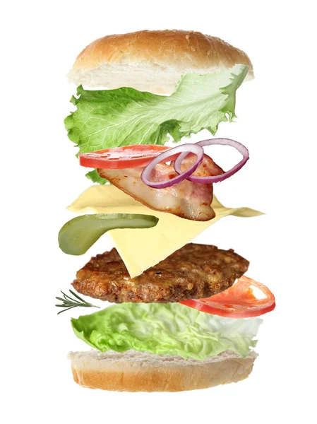 Flying ingredients for tasty burger on white background