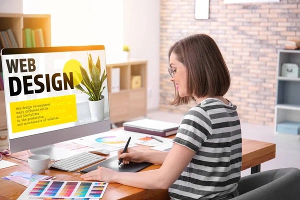 Beautiful young designer working in office — Stock Photo, Image
