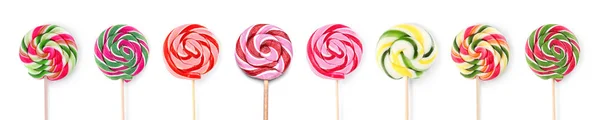 Different tasty lollipops on white background — Stock Photo, Image