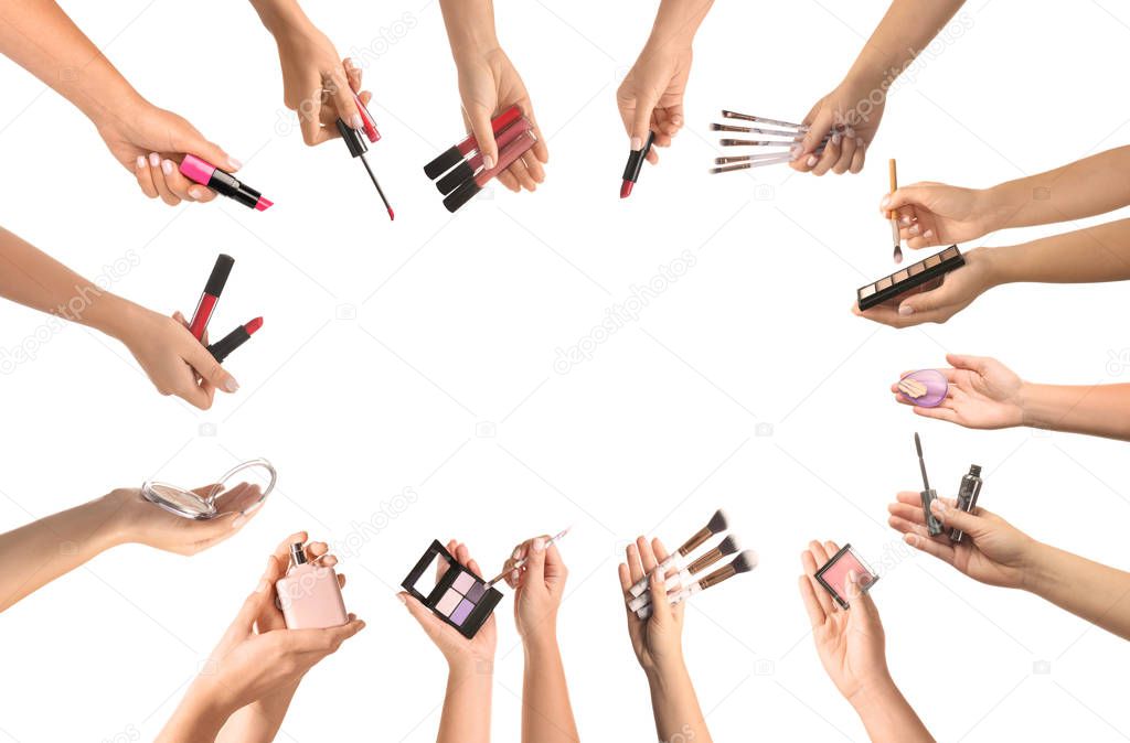 Female hands with makeup cosmetics and accessories on white background