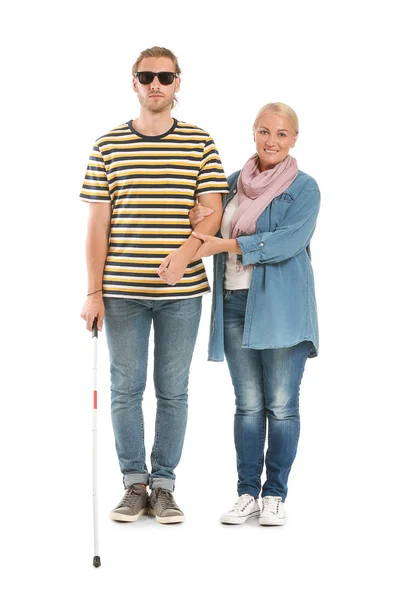 Blind young man with mother on white background — Stock Photo, Image