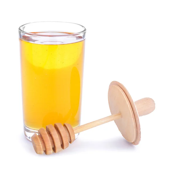 Glas süßen Honig auf weißem Hintergrund — Stockfoto