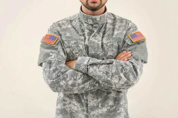 Soldier in camouflage on light background — Stock Photo, Image