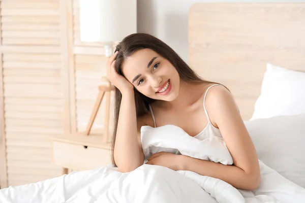 Morning of beautiful young woman in bedroom — Stock Photo, Image