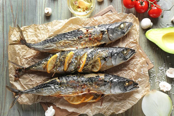 Baked mackerel fish on wooden table — Stock Photo, Image