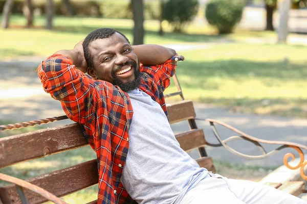 African-American man relaxing in park — Stock Photo, Image
