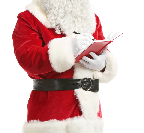 Santa Claus with notebook on white background — Stock Photo, Image