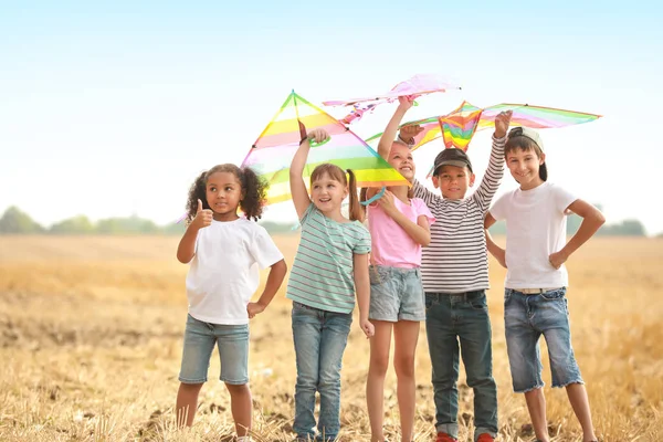 Little children flying kites outdoors — Stock Photo, Image