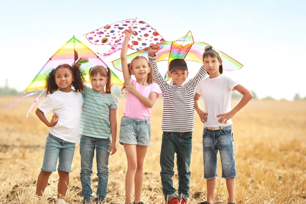 Little children flying kites outdoors — Stock Photo, Image