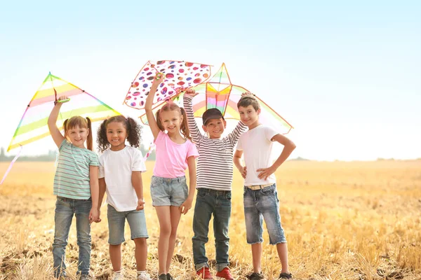 Little children flying kites outdoors — Stock Photo, Image