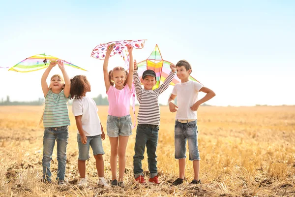 Little children flying kites outdoors — Stock Photo, Image