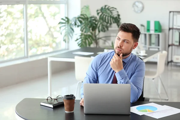 Portrait of thoughtful businessman in office — Stock Photo, Image