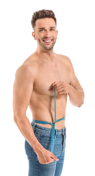 Bellissimo uomo muscoloso con nastro adesivo su sfondo bianco. Perdita di peso concetto — Foto Stock