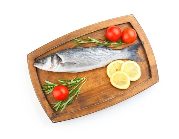 Board with fresh seabass fish, lemon, rosemary and tomatoes on white background — Stock Photo, Image