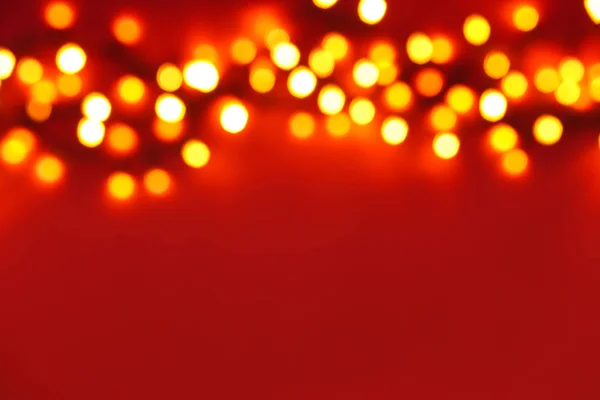 Rozmazané vánoční světla na barevném pozadí — Stock fotografie