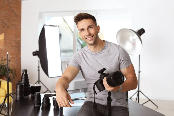 Handsome male photographer in studio — Stock Photo, Image