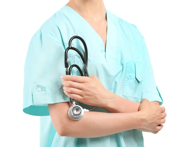 Kvinnlig sjuksköterska med stetoskop på vit bakgrund, närbild — Stockfoto